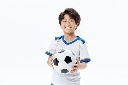 足球训练小男孩拿足球形象背景