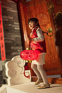 小女孩手提红灯笼庆祝新年图片