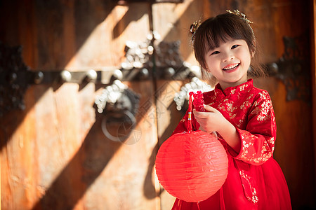 喜庆元素可爱的小女孩拿着红灯笼背景