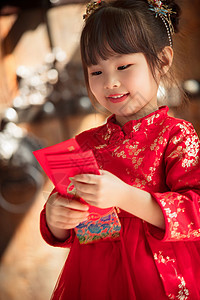 可爱的小女孩拿着红包背景图片