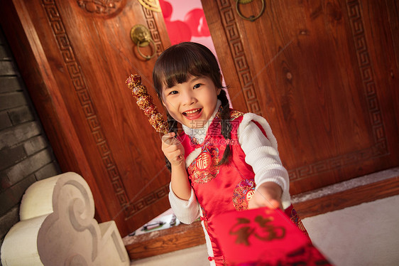 吃糖葫芦的快乐小女孩图片