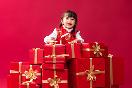 幸福的小女孩收到许多新年礼物图片