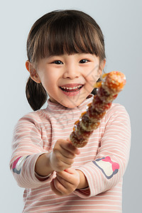 小女孩吃糖葫芦图片