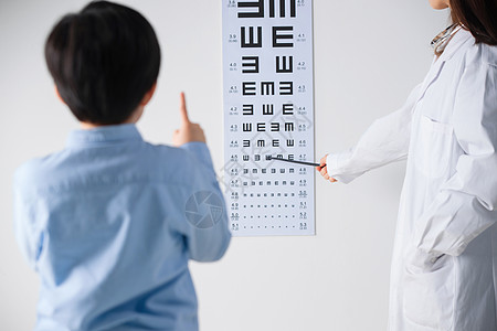 医生病人测视力小学男生测视力背景