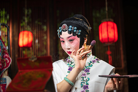 化妆品活动京剧女演员对着镜子化妆背景
