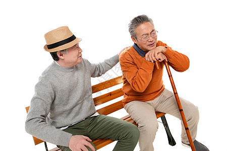两位老年朋友坐在长椅上聊天图片