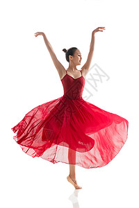 穿红色裙子跳芭蕾舞的青年女人图片