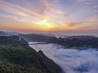 湖南湘西矮寨大桥云海日出航拍背景图片