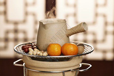 茶室围炉煮茶烤橘子果干图片