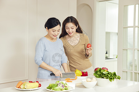 温暖健康母女居家厨房烹饪背景