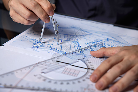 建筑工程师绘制施工工程设计图纸特写背景