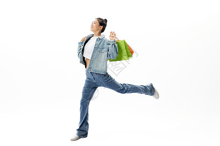 悬浮活力女性手拿购物袋背景图片