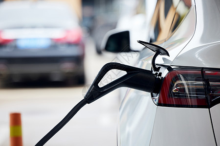 环保汽车素材充电中的新能源汽车背景