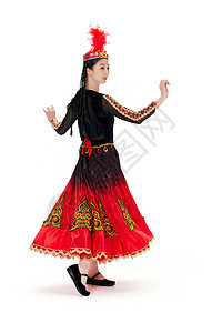穿着维族服饰跳舞旋转的女孩图片