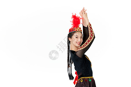 穿着维族服饰跳舞的女孩背景图片