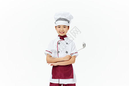 身穿厨师服的小女孩拿着勺子背景图片