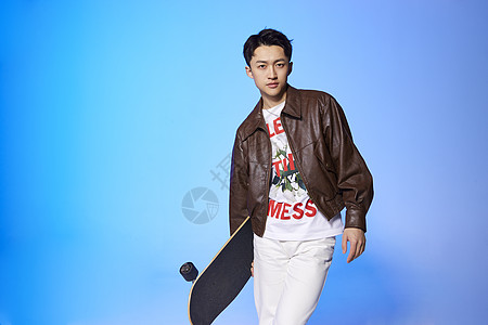 时尚滑板男孩形象背景图片