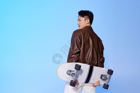 时尚滑板男青年背景图片