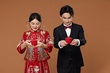 中式传统新婚夫妻敬茶背景图片
