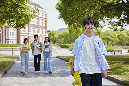 青年节走在校园里的阳光大学生形象背景