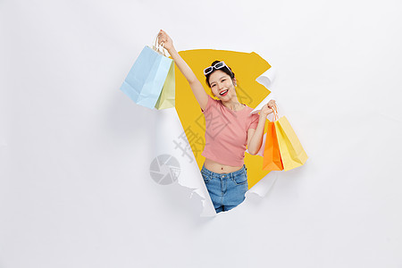 创意女性购物手拿购物袋图片