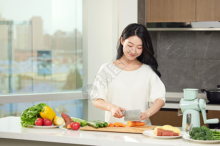 厨房食材厨房专心切菜的女性背景