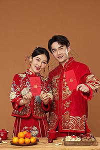 红包美女传统中式婚礼新人手拿红包背景