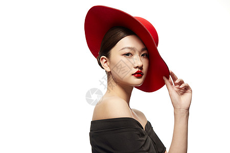 时髦女性佩戴红色帽子背景图片