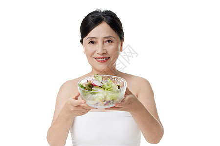 健康饮食女展示沙拉图片