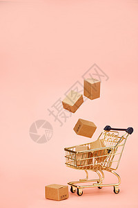网络购物概念漂浮的物流快递盒和购物车图片