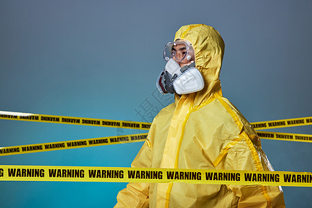 被警戒线环绕的核污染防护人员背景图片