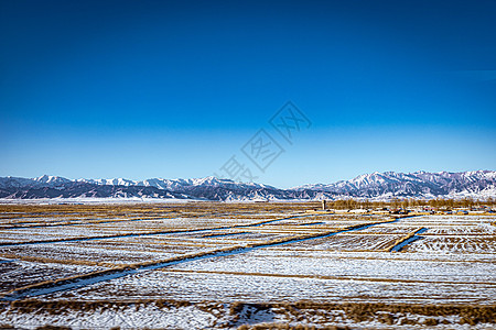 航拍初雪后的甘肃张掖平山湖大峡谷背景图片