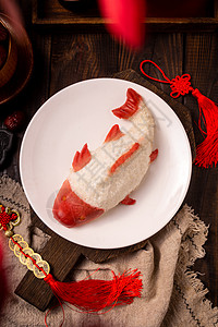 春节期间家里的年年有鱼糯米饭背景图片