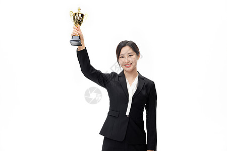 获奖商务美女高举奖杯的职业女性形象背景