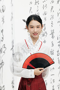 水墨扇子拿着扇子的中国风美女背景