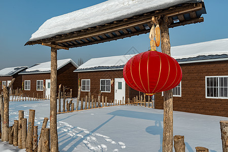 冬季农家乐乡村冰雪红灯笼背景图片