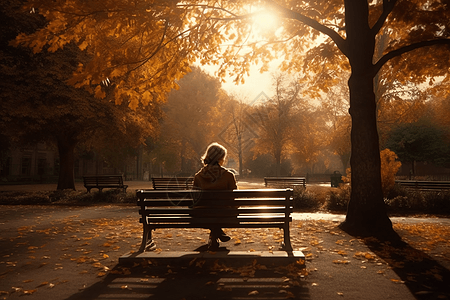 一个女人安静的坐在公园的长椅上图片
