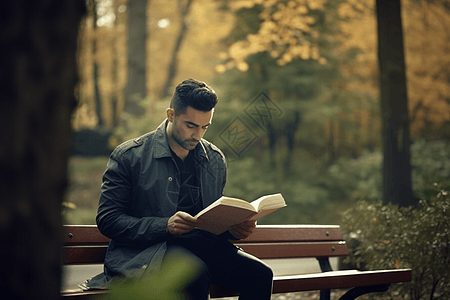 在长椅上阅读的男人图片