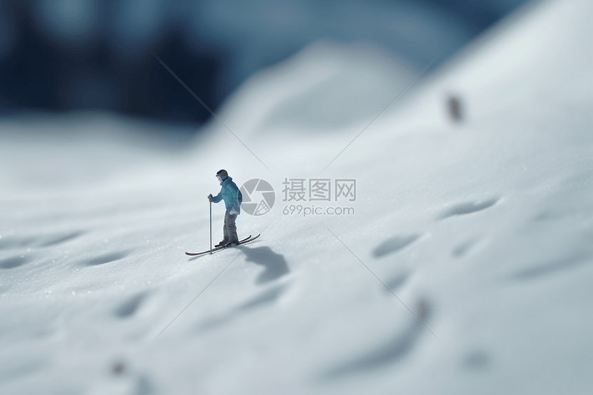 一个小人在雪山上滑雪图片