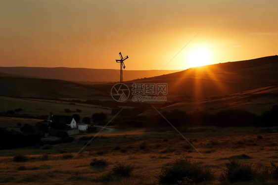 夕阳山丘和风车图片