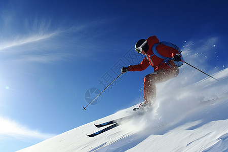 滑雪者在深蓝色的天空下进行跨度滑雪图片