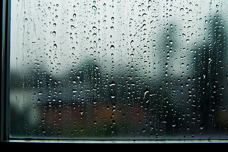 阴雨天气窗户上的雨滴背景图片