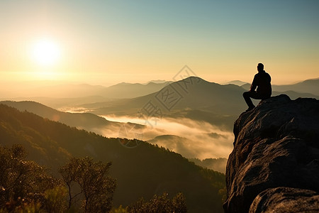 登山者站在最高的山峰看风景图片