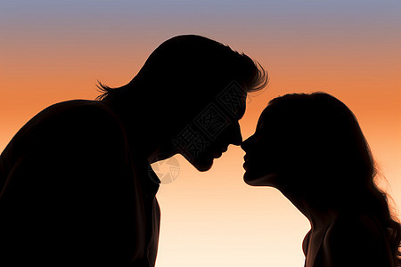 日落时相爱的情侣接吻剪影图片