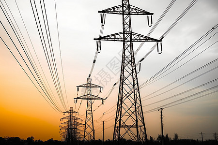 日落时分的输电塔高压电线景观图片