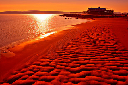 日出下的红色海滩背景图片