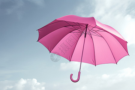 粉红色雨伞在天空上图片