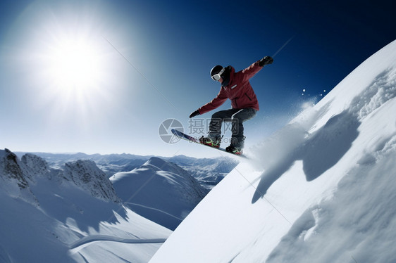 雪山上滑单板的年轻人图片