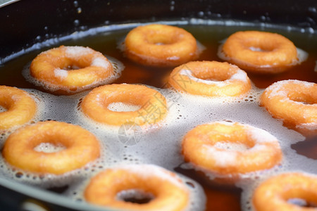 油炸甜甜圈传统早餐水高清图片