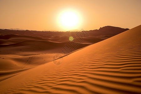 日落的沙漠背景图片